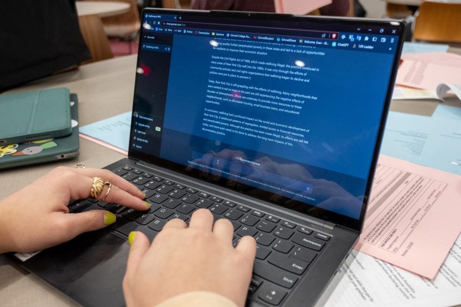 Photo of a student using a computer with ChatGPT pulled up.