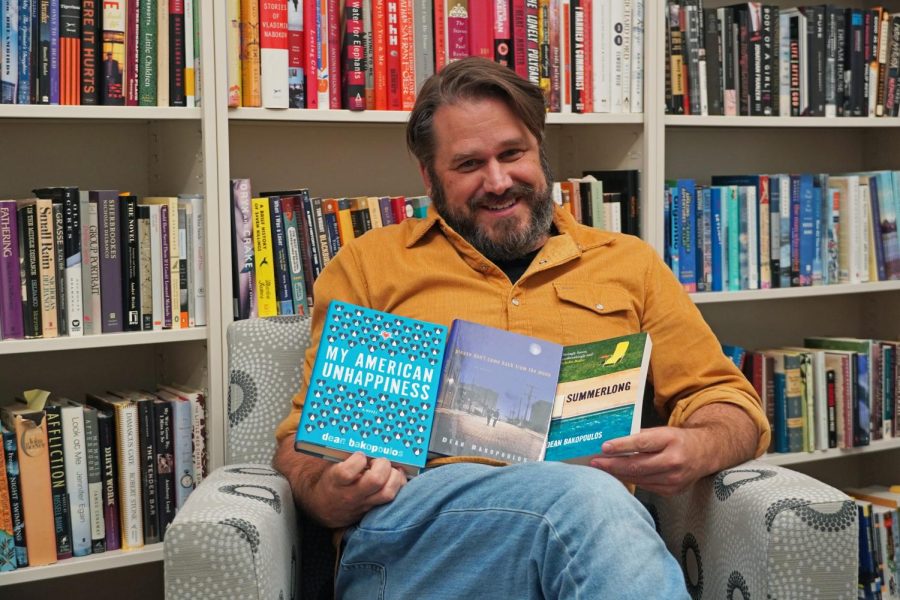 Bakopoulos sits in his office with his three books, "Summerlong," "Please Don't Come Back From the Moon," and "My American Unhappiness."