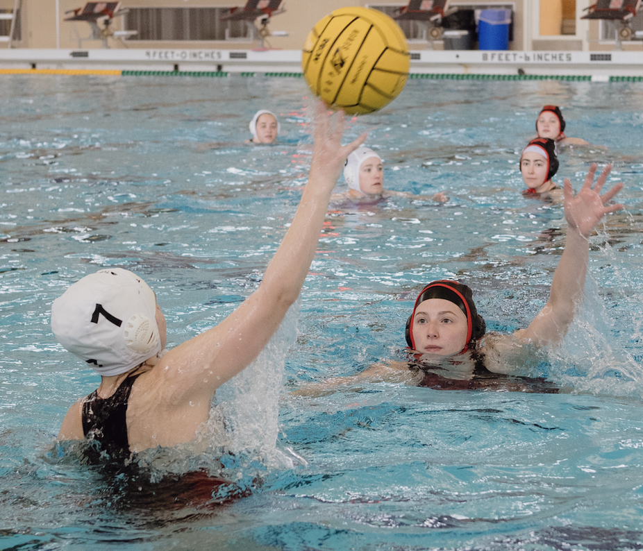 Grinnell's Fireballs (dark caps) defend against Carleton College's attack at the Heartland Division Championship in April 2023.