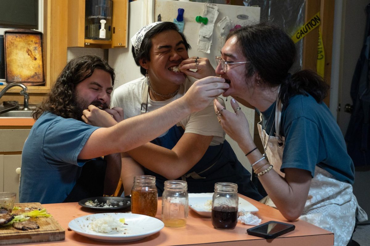From left: Sam Sirna `25, Phukao Prommolmard `24.5, and Andrew Lim `25 ravenously enjoy their Monday nights bonding over food.