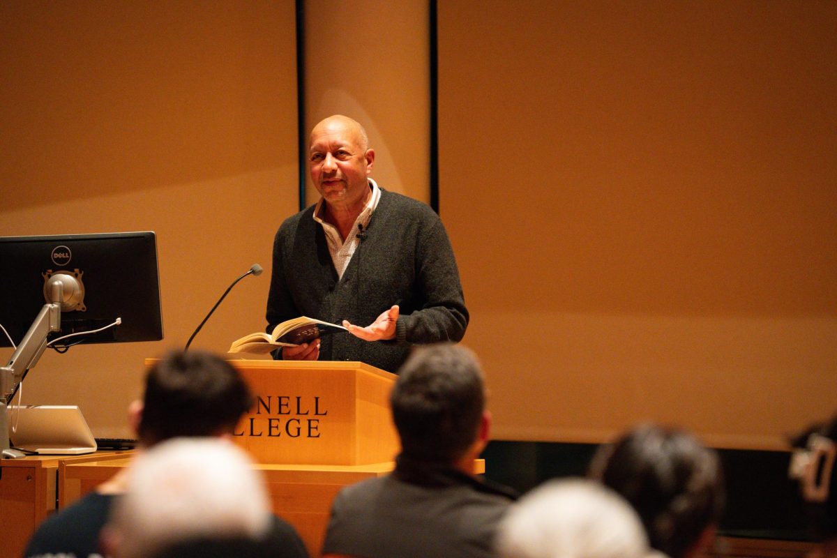 Carl Phillips reads from “Then The War: And Selected Poems,” telling the Writers@Grinnell crowd about his writing process. 