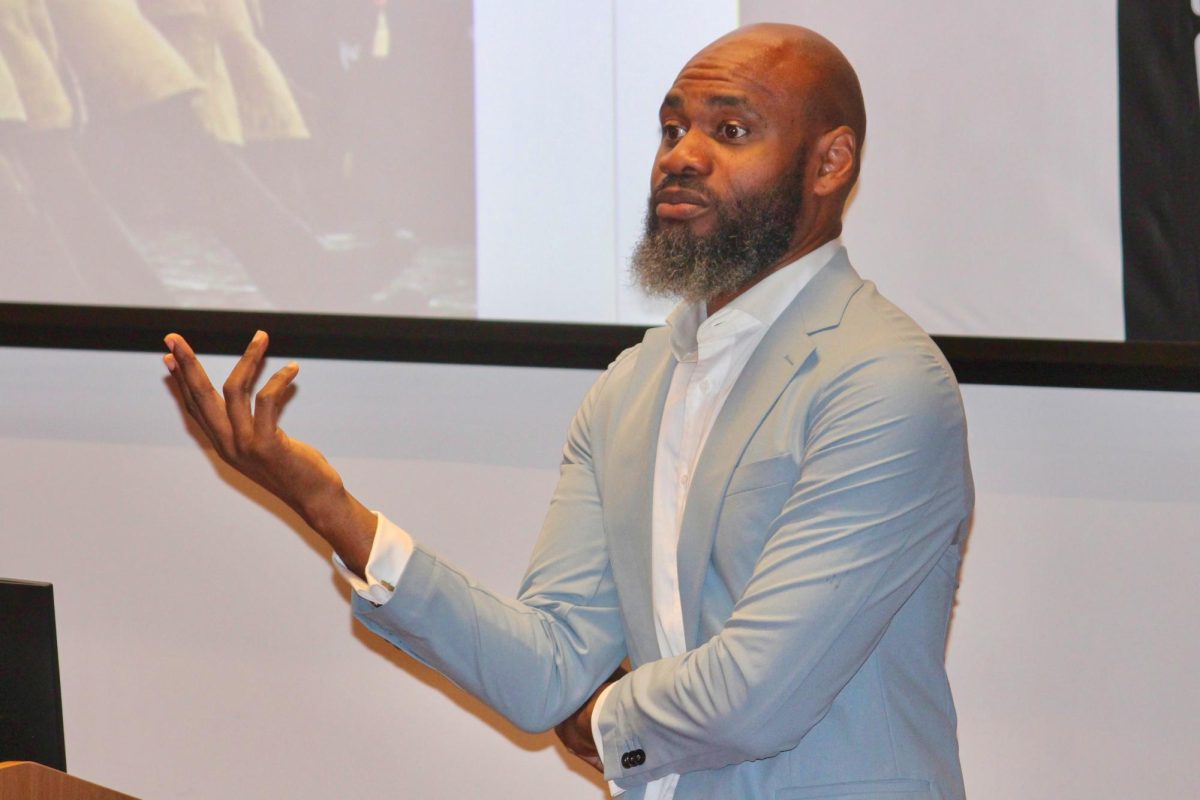 Terrell Jermaine Starr speaks to students in HSSC auditorium. 