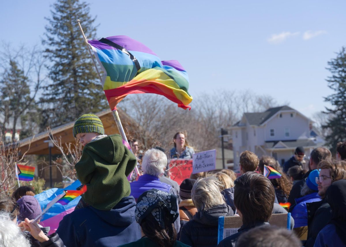 Crowd of people gather in Grinnell's Central Park protesting against House File 583 (HF583), organized by the Grinnell Organizing Collective.