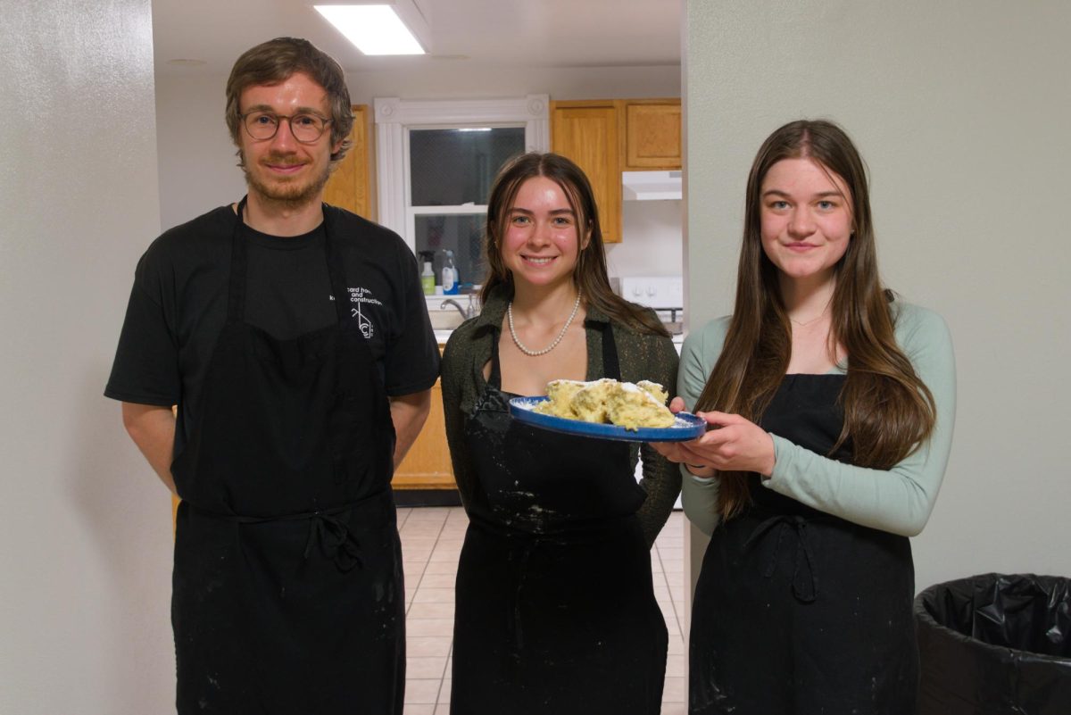 From left: Aaron Boeller (German Language Assistant), Katya Lackey `27 and Jane Hoffman `25 make Kaiserschmarrn. 