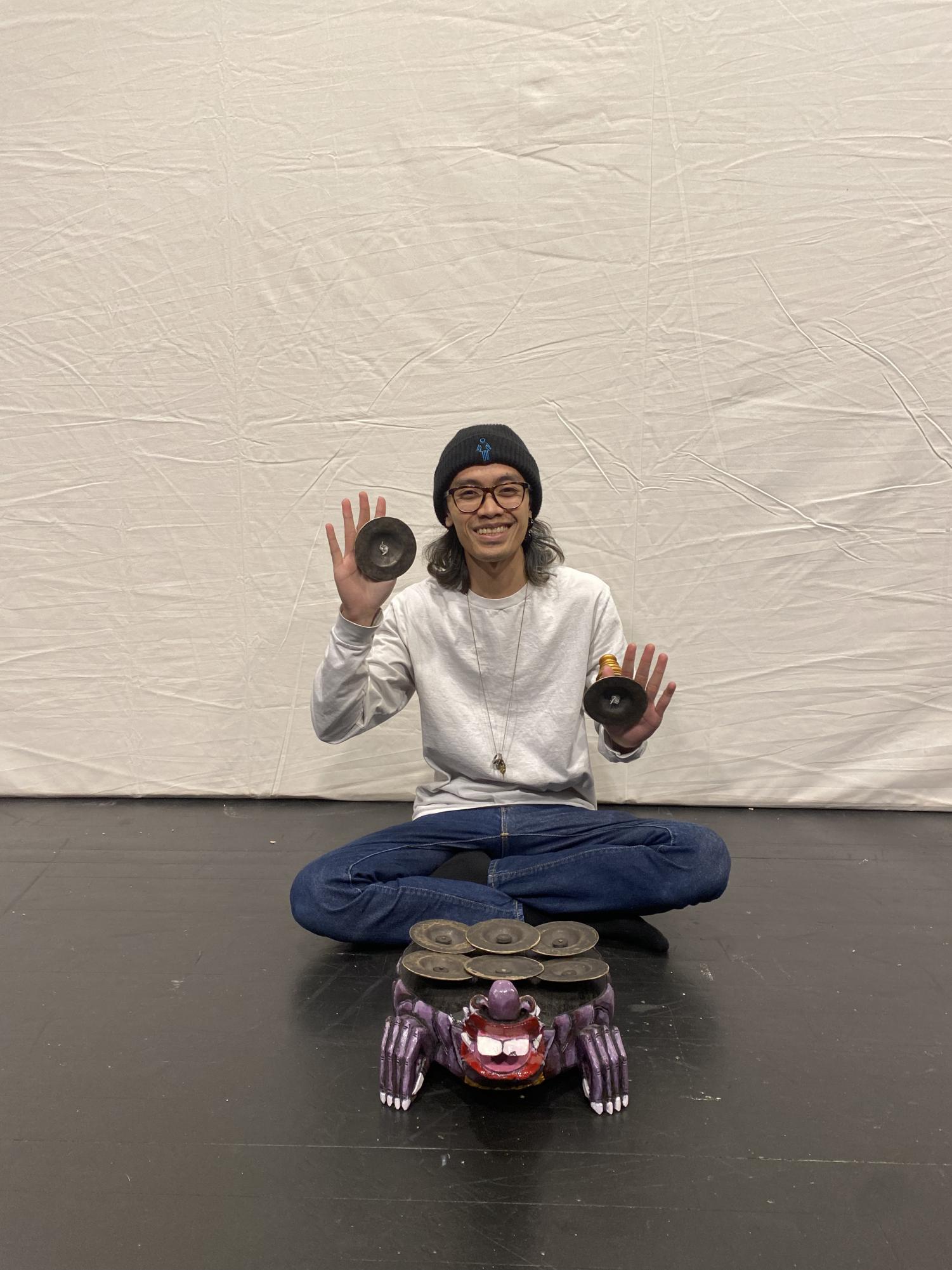 Putu Hiranmayena, assistant professor of music, poses in the Bucksbaum Arts Center. 