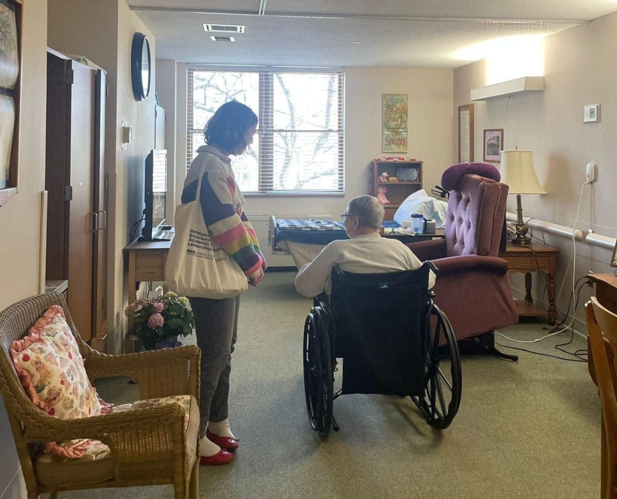 From left: Thai Theodoro `27 and Karla Breed have a conversation at the Mayflower Community.